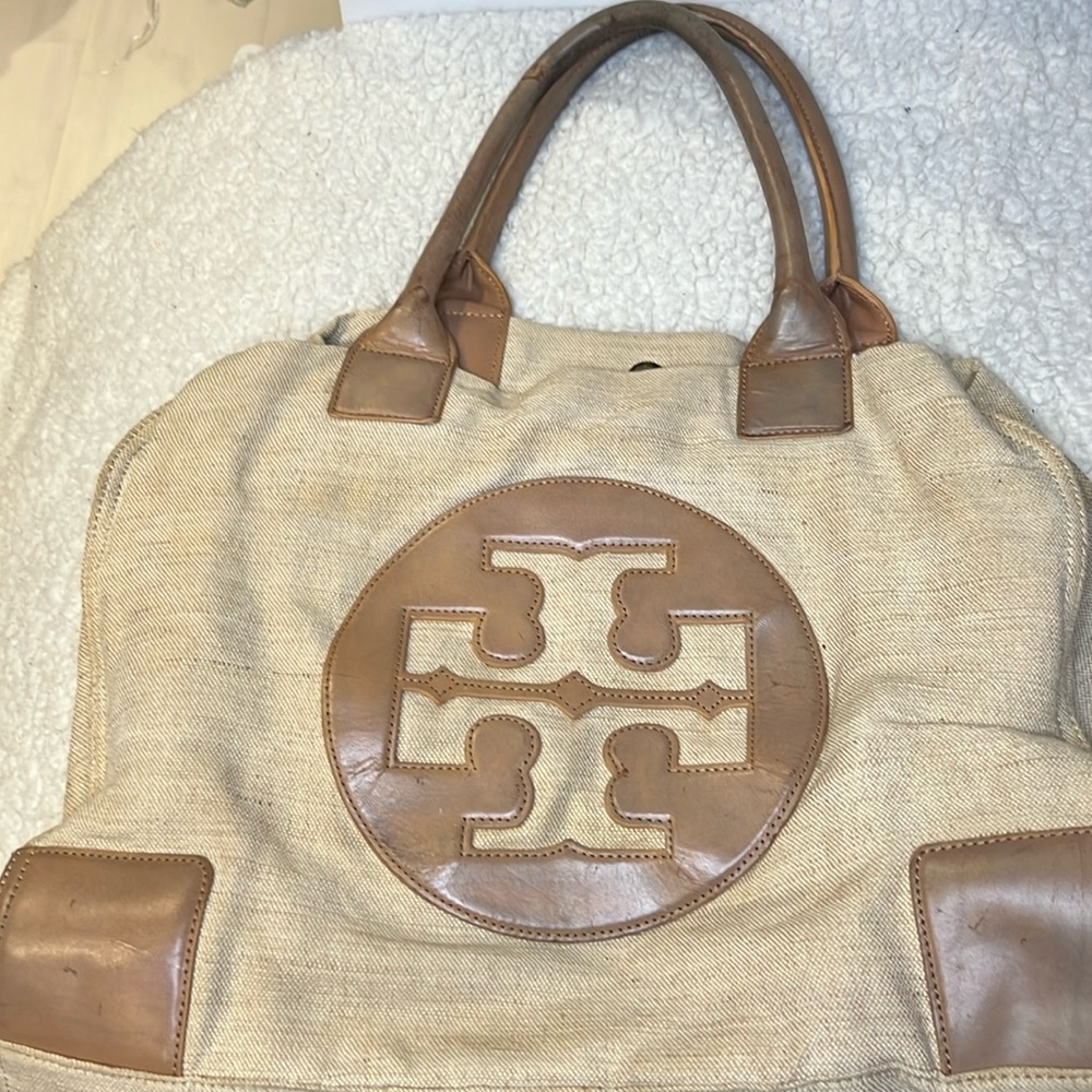 Tory Burch canvas neutral color with brown leather handles and trim !